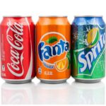 Bottles of Coca-Cola, Fanta, and Sprite soda drinks